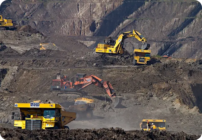 Asset management consultants reviewing plant and reliability information in a heavy asset industry setting